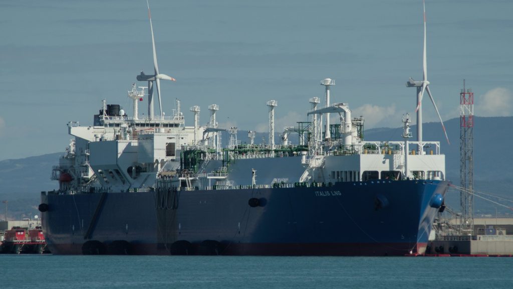 An LNG carrier berthed at a gas terminal