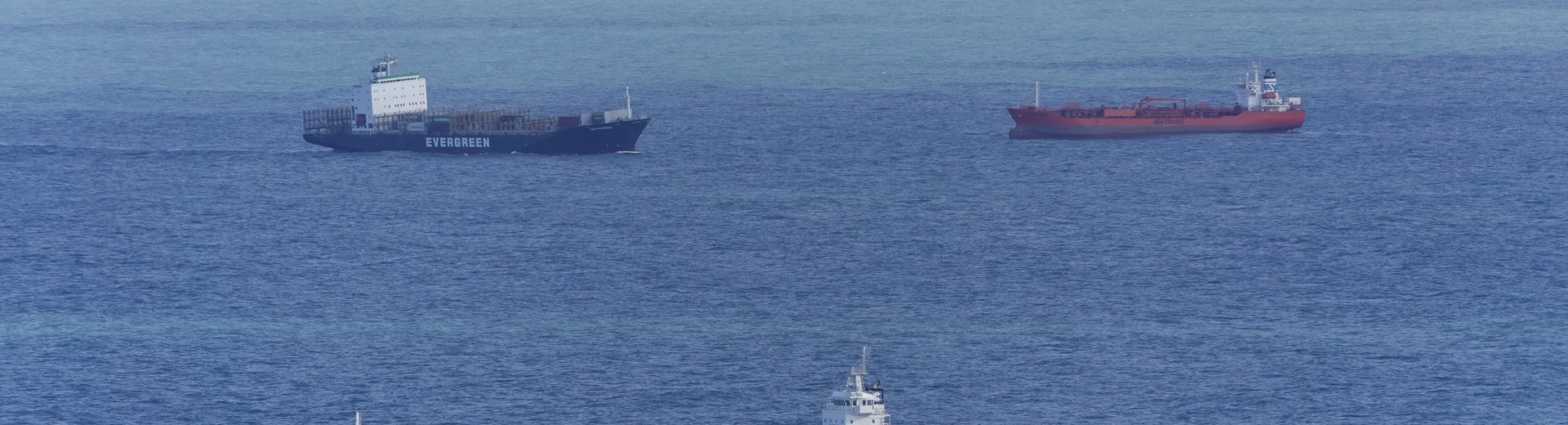 Cargo vessels lying at anchor in the roads