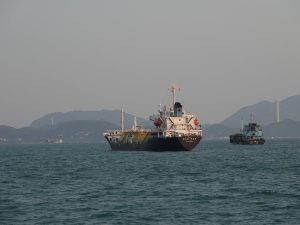 Tanker and support craft in coastal waters