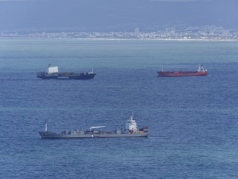 Cargo vessels lying at anchor in the roads